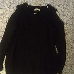 This is a ruff hewn , off the shoulder sweater